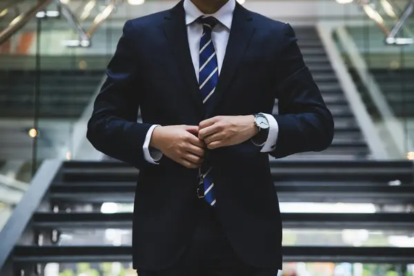 Man in a suit no head